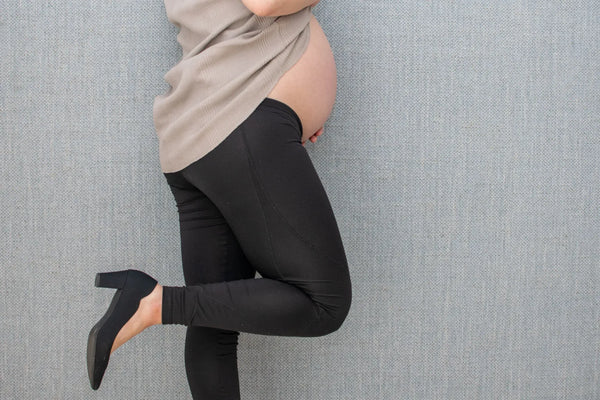 Pregnant woman considering wearing high heels during pregnancy