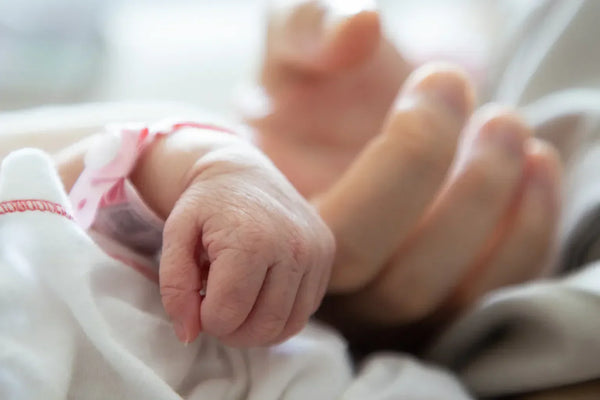 Doctor reviewing causes of preterm birth including bacterial infections and prevention strategies