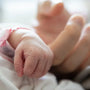 Doctor reviewing causes of preterm birth including bacterial infections and prevention strategies