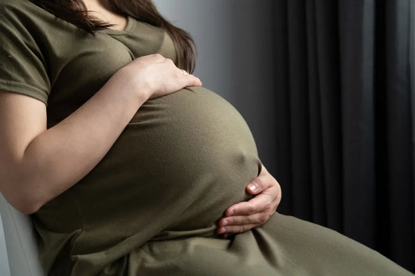 Pregnant woman at 41 weeks discussing induction options with her doctor