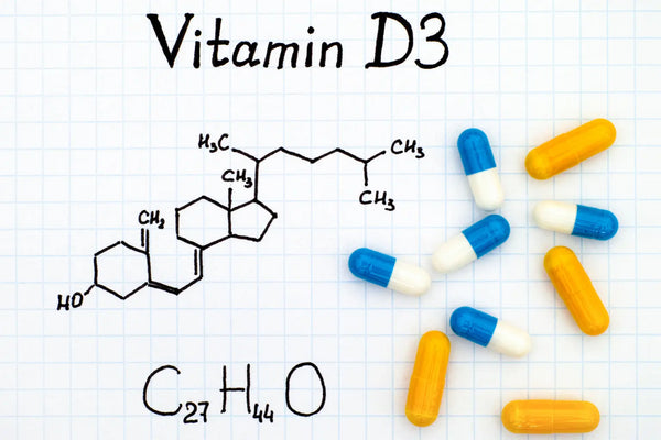 Vitamin D3 supplement capsules with sunlight and healthy foods rich in cholecalciferol
